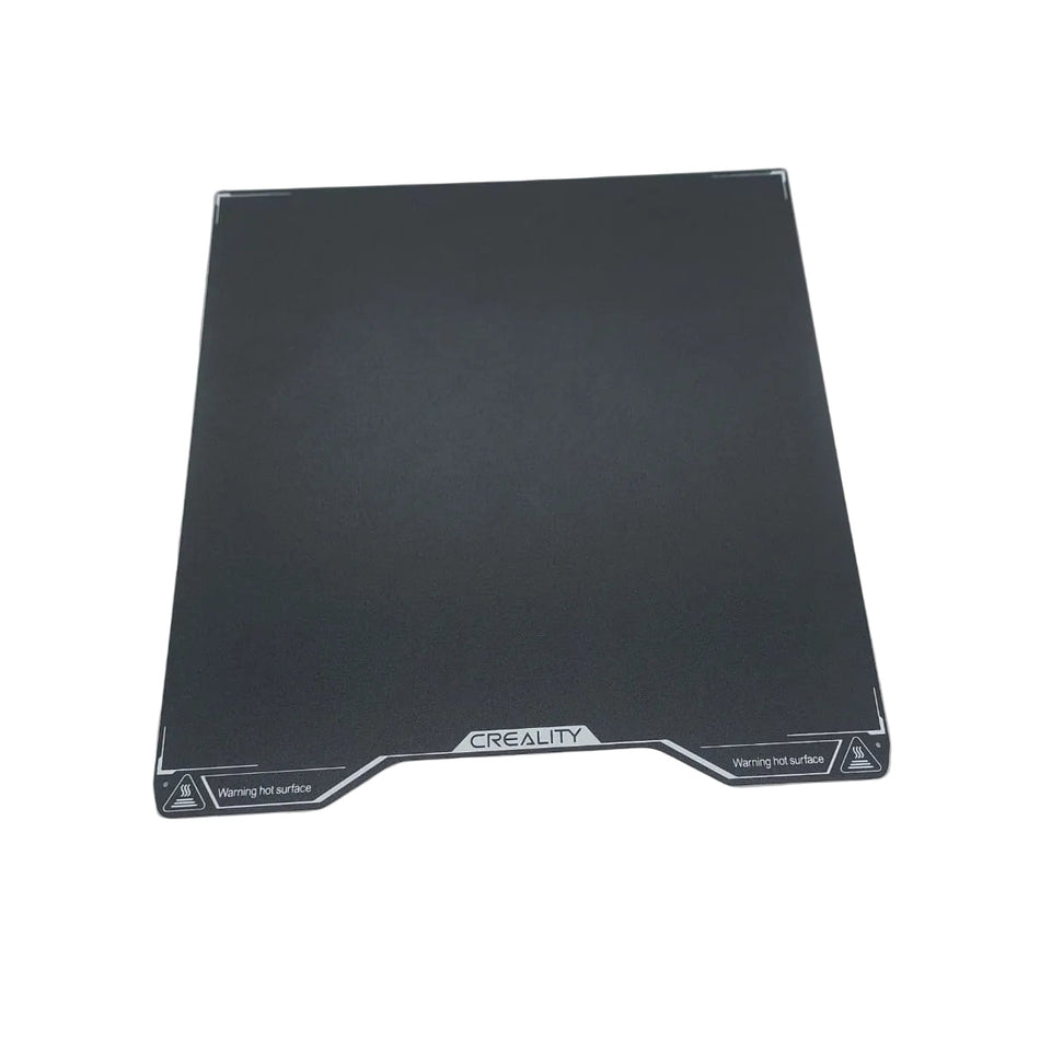 Black 3D printing platform with 'CREALITY' branding on a white surface